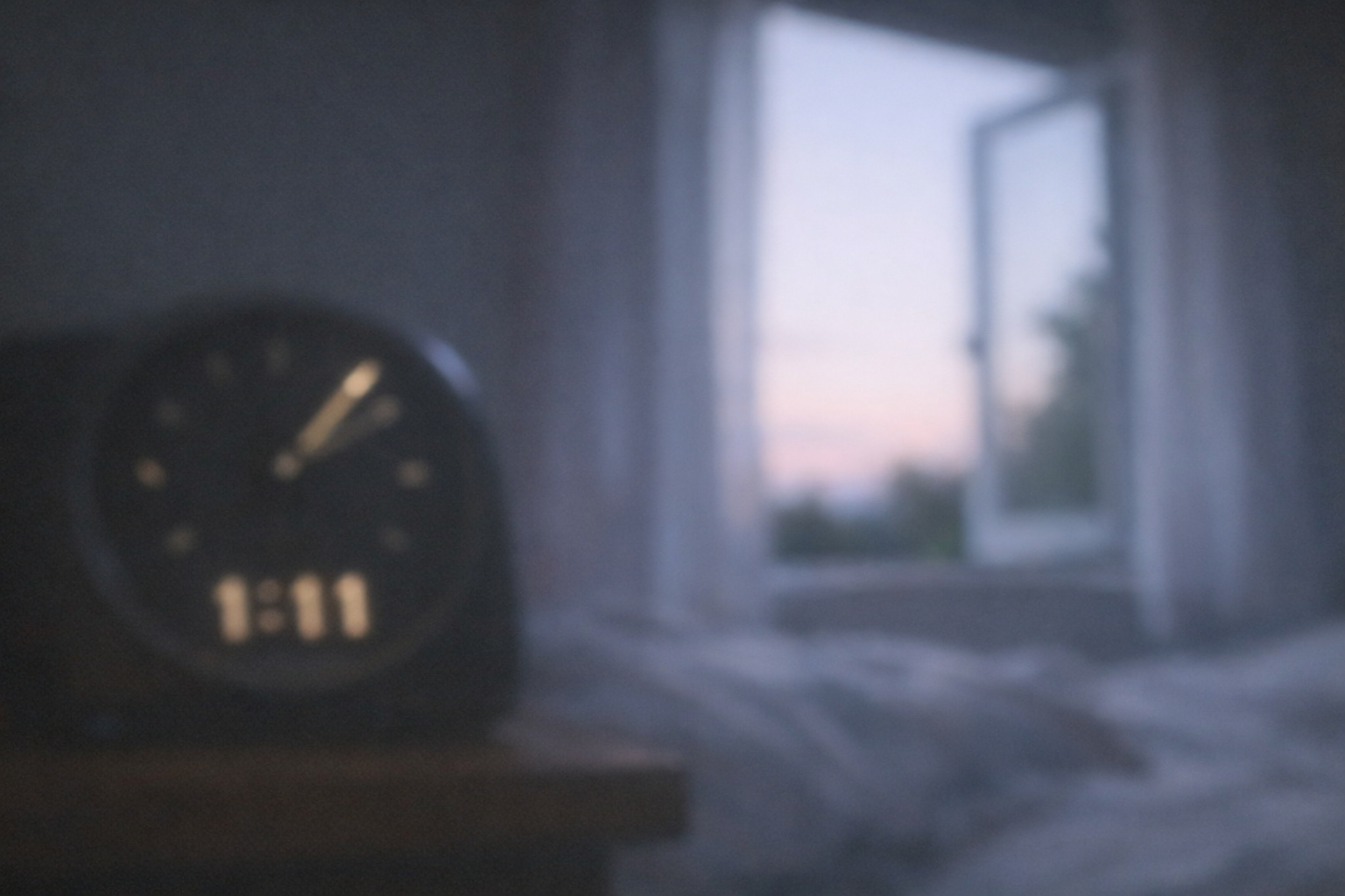 Bedside clock at 1:11 with dawn light