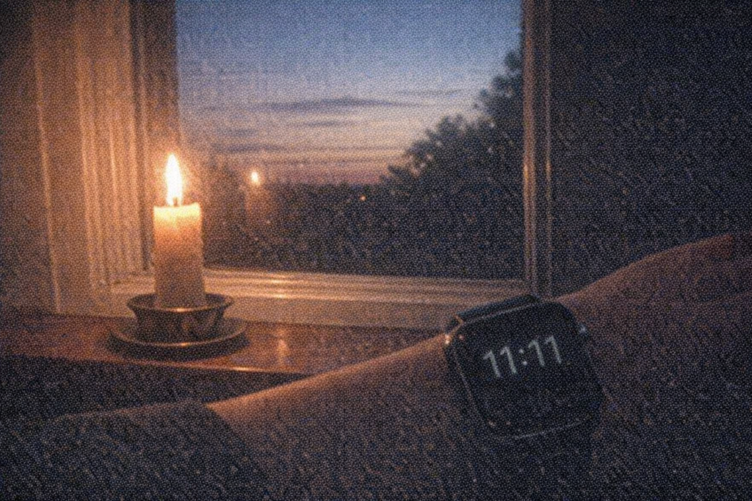 Candlelight and smartwatch at sunset